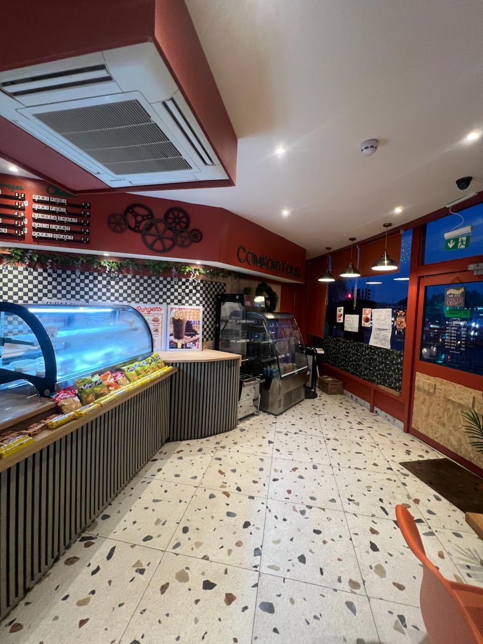 Interior view of Asian dining area and service counter in Hayes, London